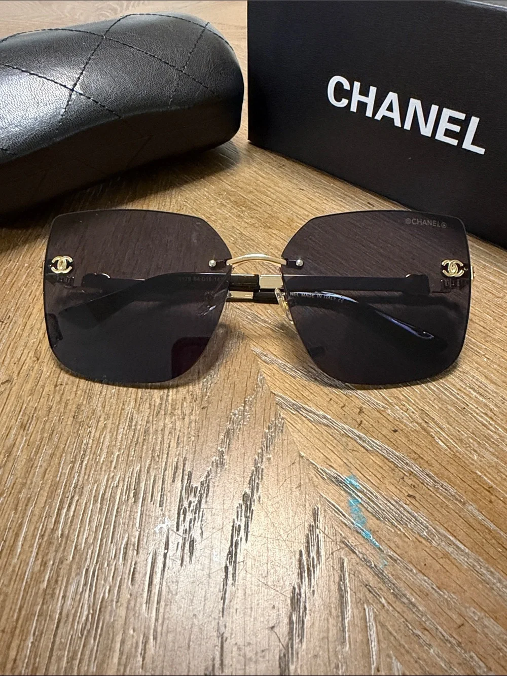 CHANEL Rimless Square Sunglasses in Dark Gradient with Gold Accents